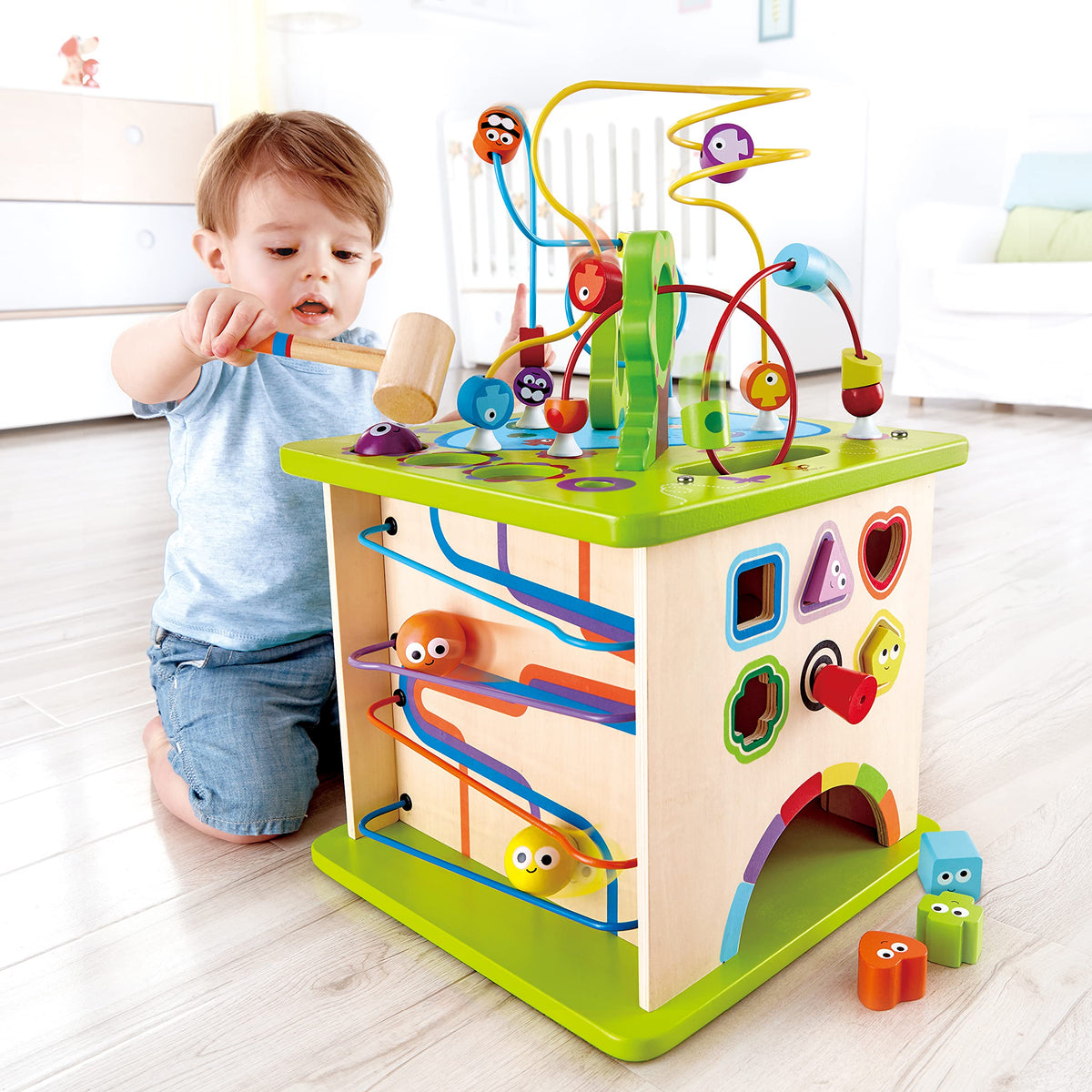 Hape Country Critters Play Cube side 2 shape sorter enhances early recognition of shapes.