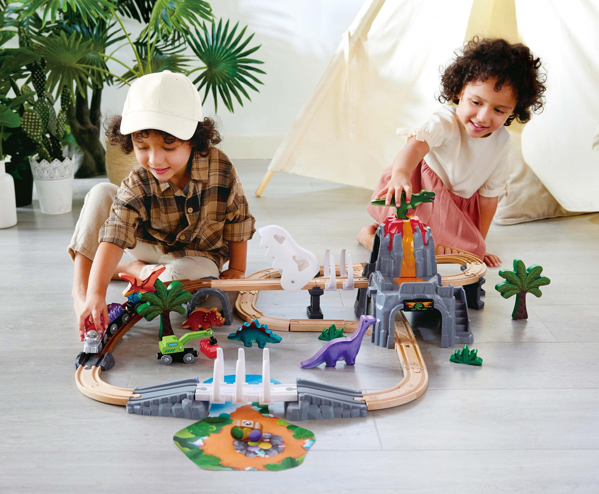 Hape Dinosaur Railway Adventure Set crane lifting cargo along tracks