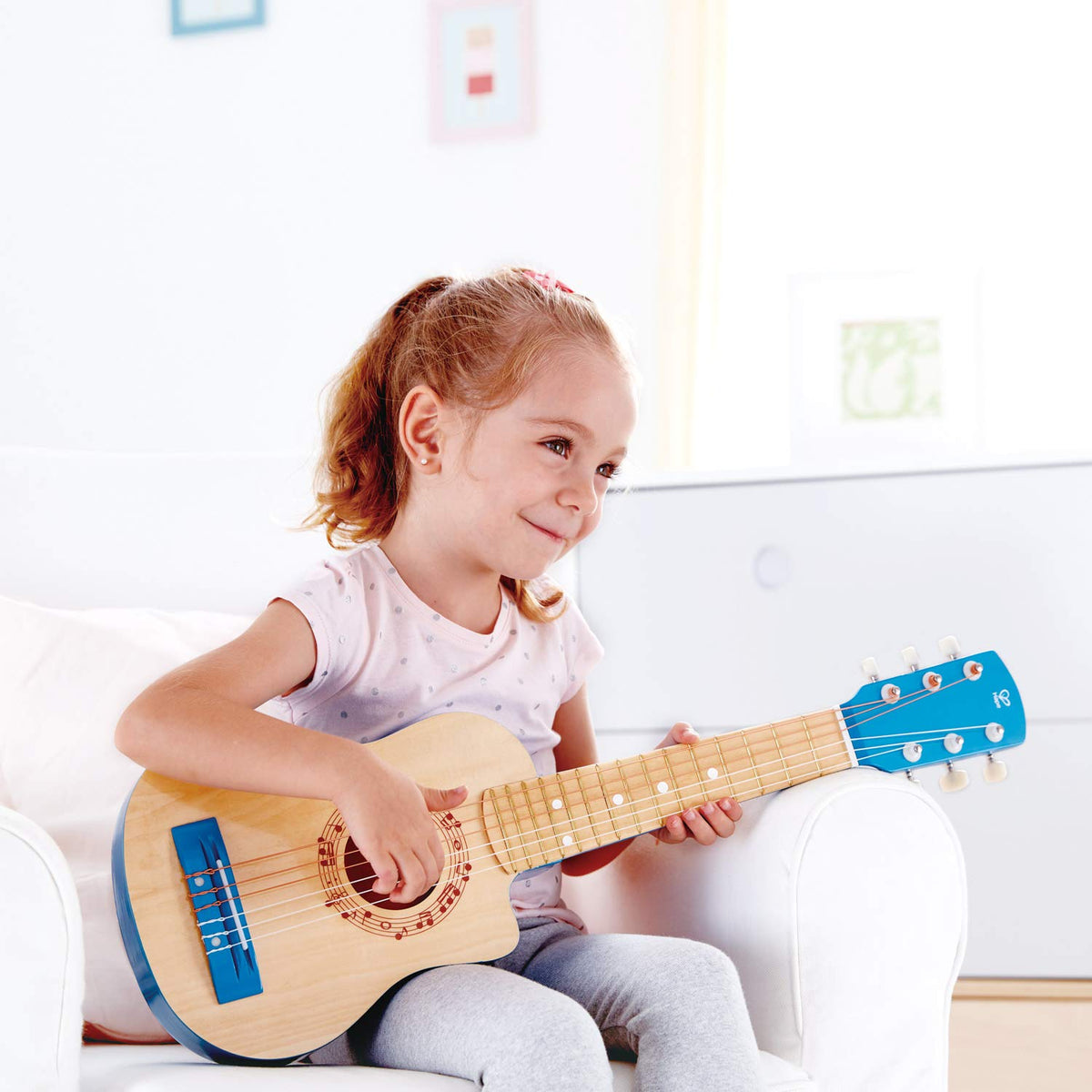 Hape 26-inch guitar blue side view highlights comfortable size for young players.