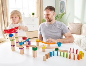 Hape Marble Run Race Track jump and bell-bucket boosts anticipation and hand-eye coordination.