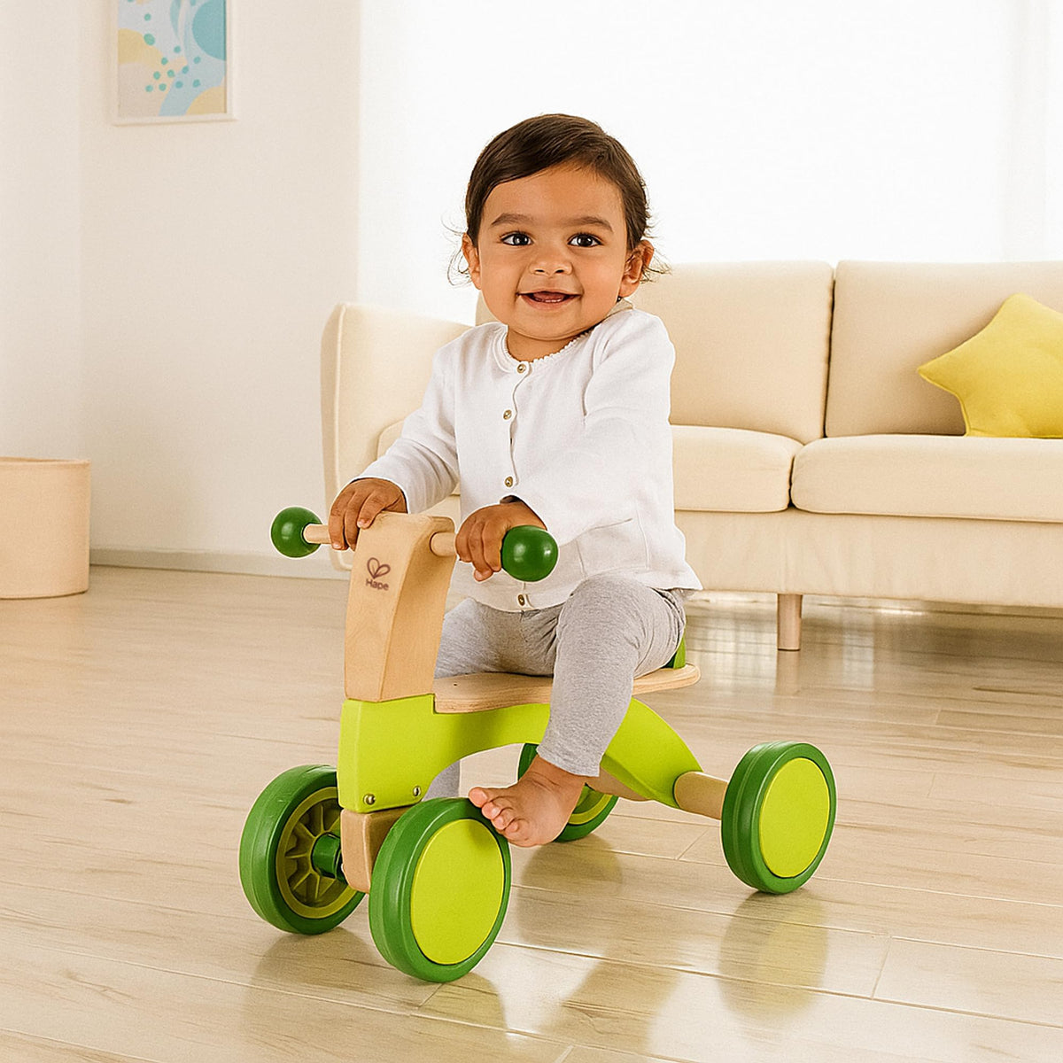Hape Scoot Around side view shows sturdy wooden frame supporting mobility