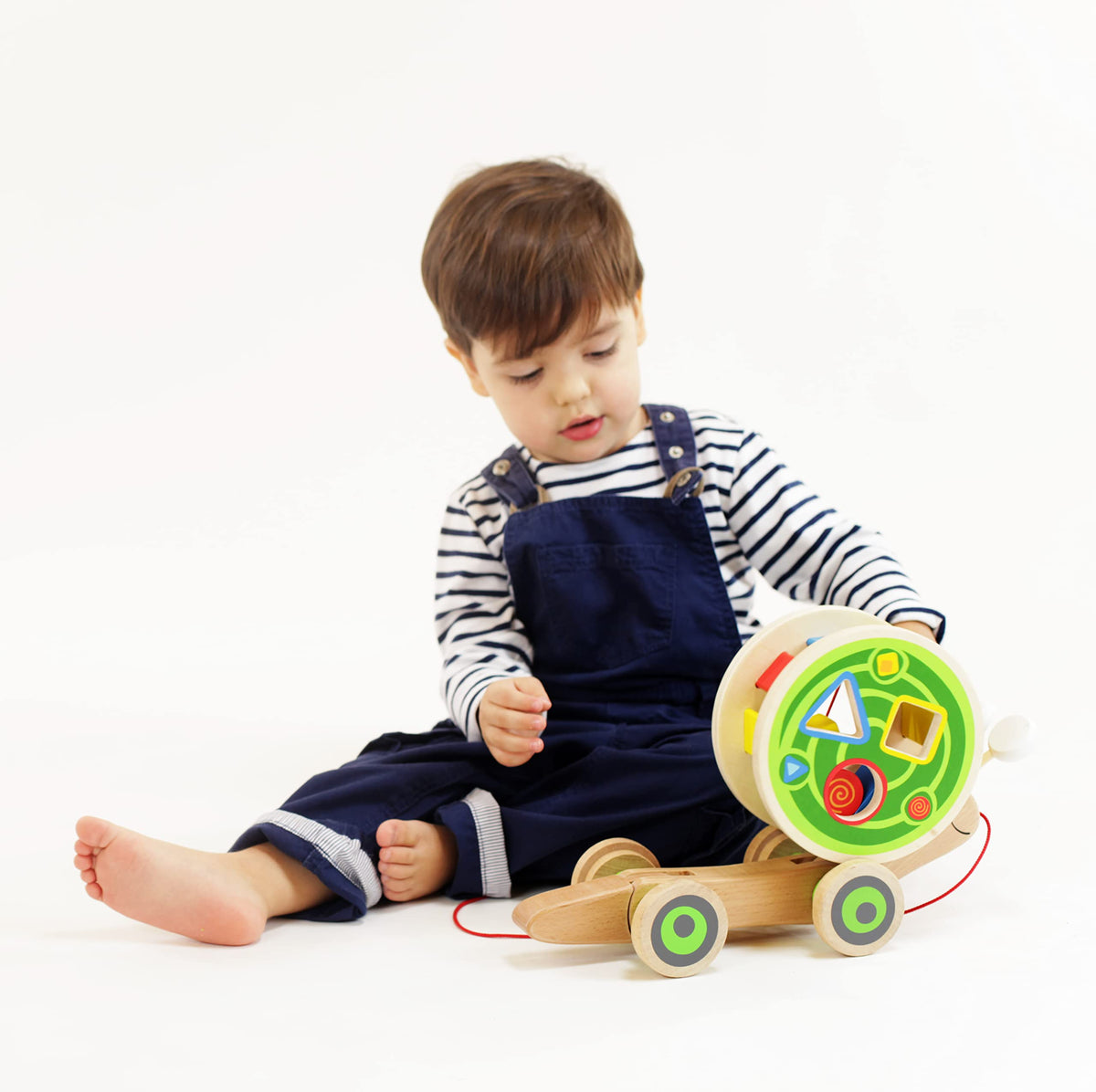 Hape Walk-A-Long Snail pulled with tail waving encourages active play.