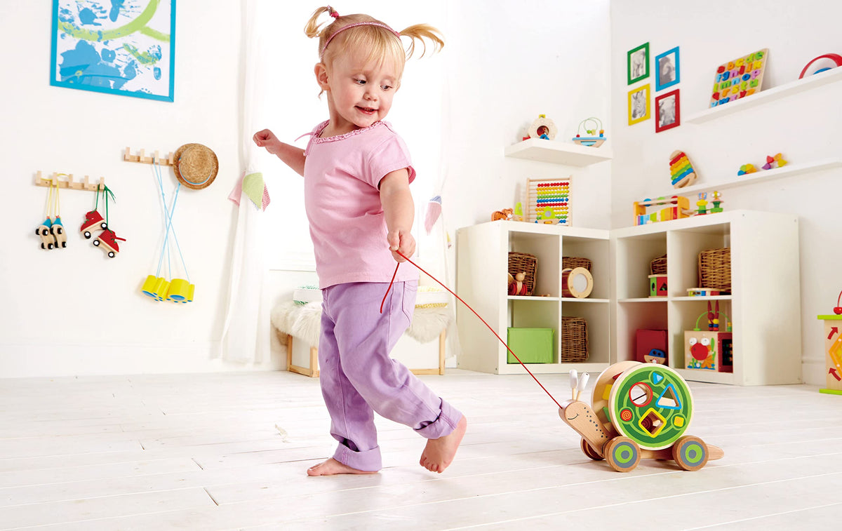 Hape Walk-A-Long Snail removable shell enables quick access to blocks.