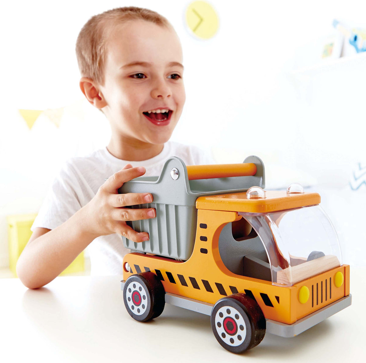 Hape wooden dump truck with load blocks ready for imaginative construction projects.