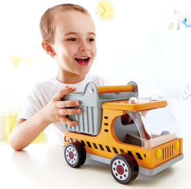 Hape wooden dump truck with load blocks ready for imaginative construction projects.