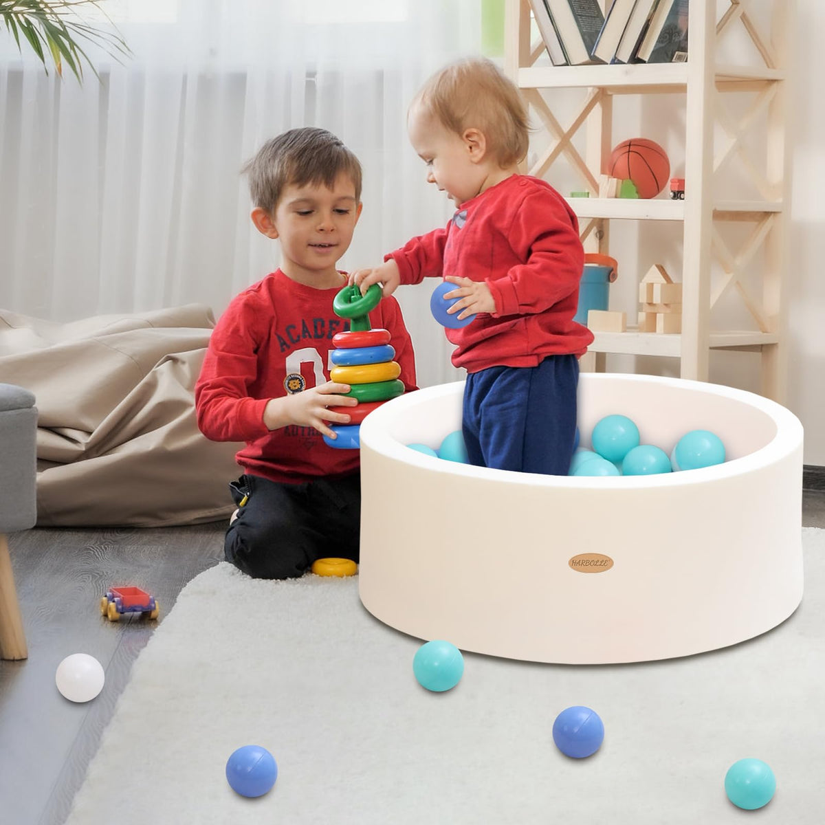 HARBOLLE ball pit in white blends with home decor.