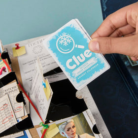 Hasbro Clue Secrets Under Snowfall winter-themed tokens add character flair.