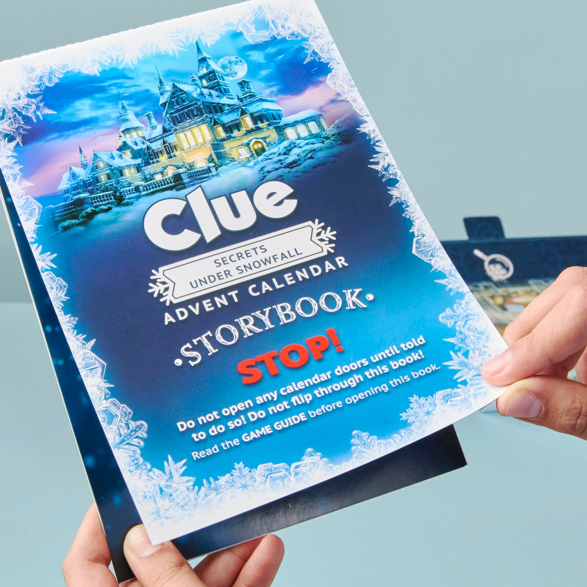 Hasbro Clue Secrets Under Snowfall story packaging elevates holiday gift appeal.
