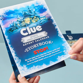 Hasbro Clue Secrets Under Snowfall story packaging elevates holiday gift appeal.