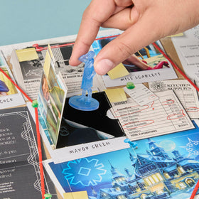 Hasbro Clue Secrets Under Snowfall surprise gift token sparks extra mystery.