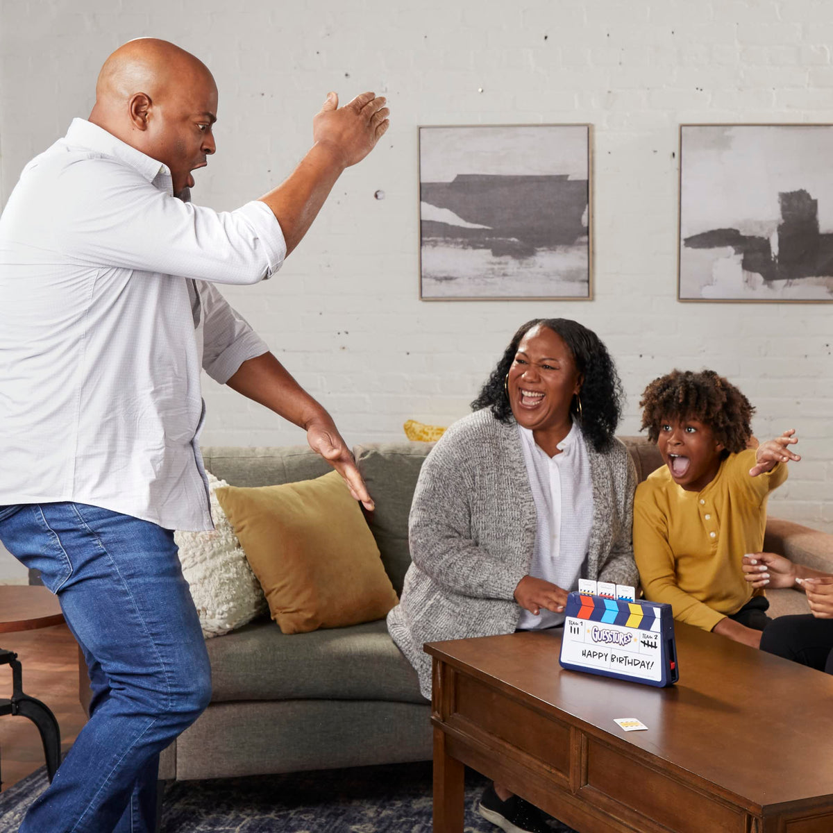 Hasbro Gaming Guesstures ages 8+ suitability for family fun.
