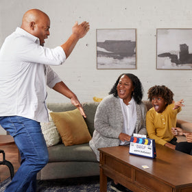 Hasbro Gaming Guesstures ages 8+ suitability for family fun.
