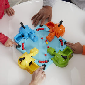 Hasbro Gaming Hungry Hungry Hippos golden marble shines as an instant win moment.