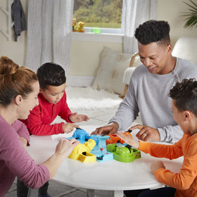 Hasbro Gaming Hungry Hungry Hippos hippo figures ready for chomping action.