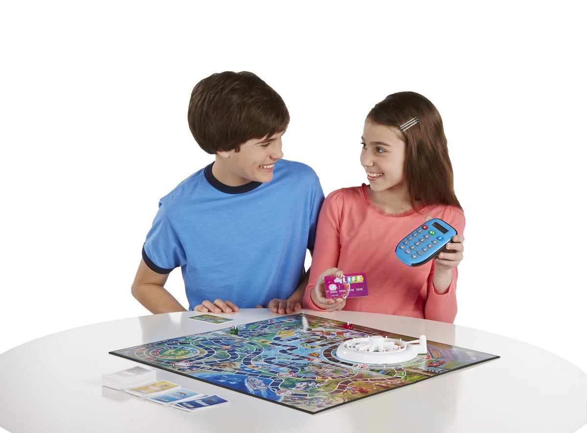 Hasbro Gaming The Game of Life career and house spaces guide player paths.