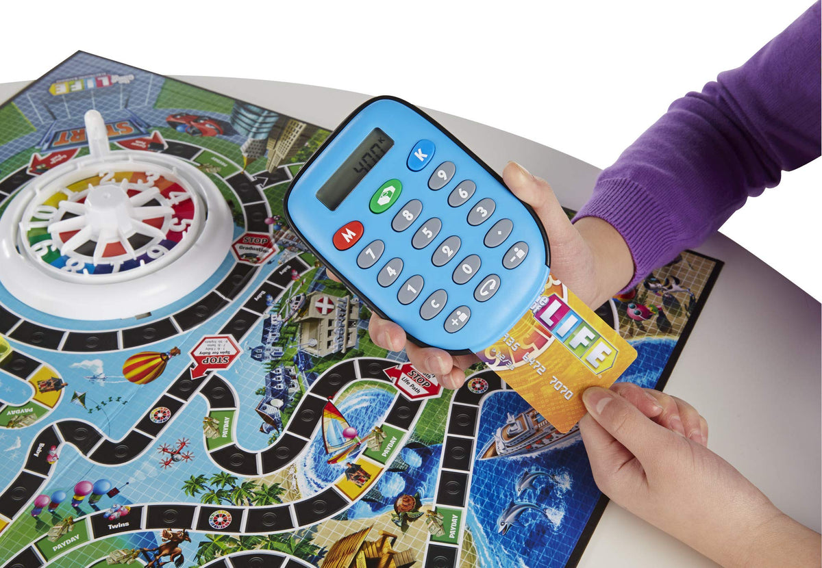 Hasbro Gaming The Game of Life spin to win spaces create excitement and rewards.