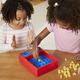 Hasbro Perfection game teaches shape recognition through hands-on play.