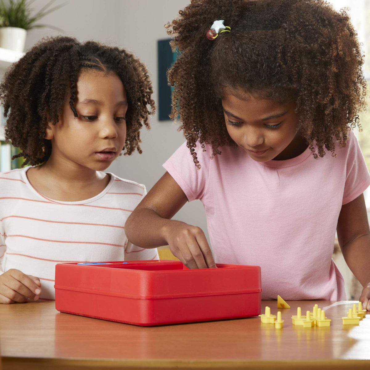 Hasbro Perfection puzzle gameboard with 25 shapes for learning through play.