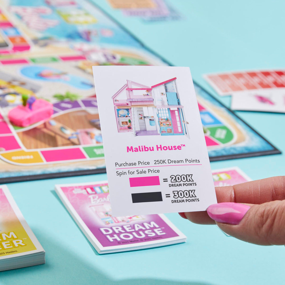 Hasbro The Game of Life Barbie Edition Trend setter text; invites kids to create style moments during gameplay.