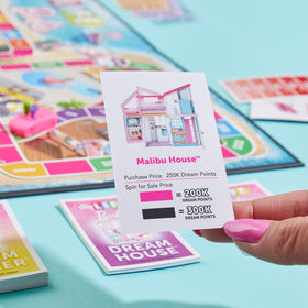 Hasbro The Game of Life Barbie Edition Trend setter text; invites kids to create style moments during gameplay.