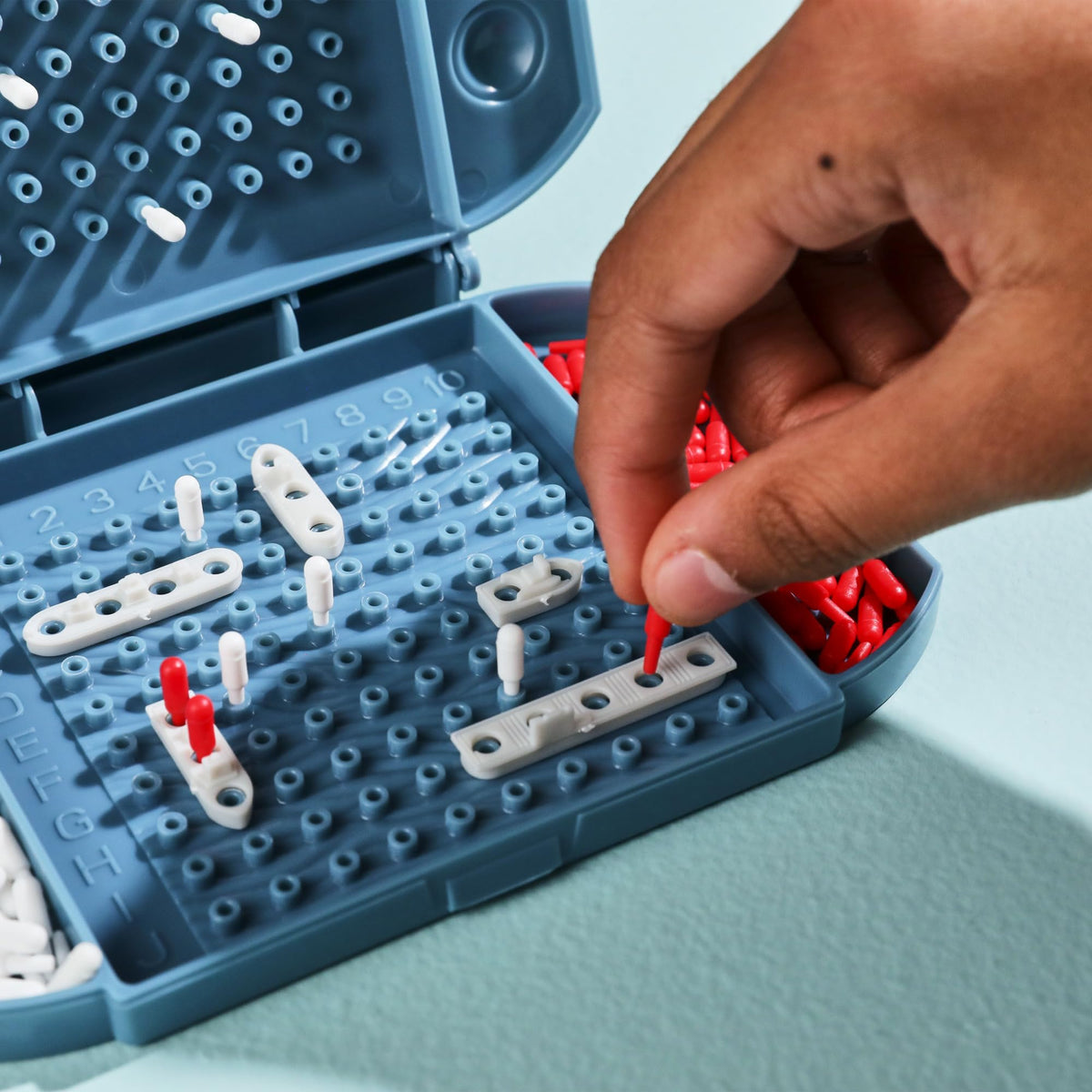Hasbro Grab and Go bundle storage tray keeps pieces organized.