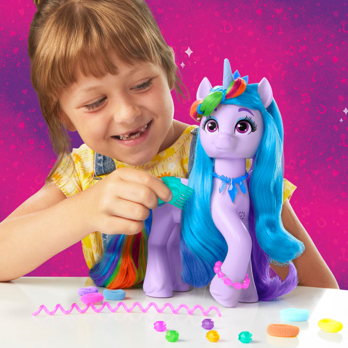 Hasbro Izzy Moonbow spinning rainbow tail creates dynamic movement during play