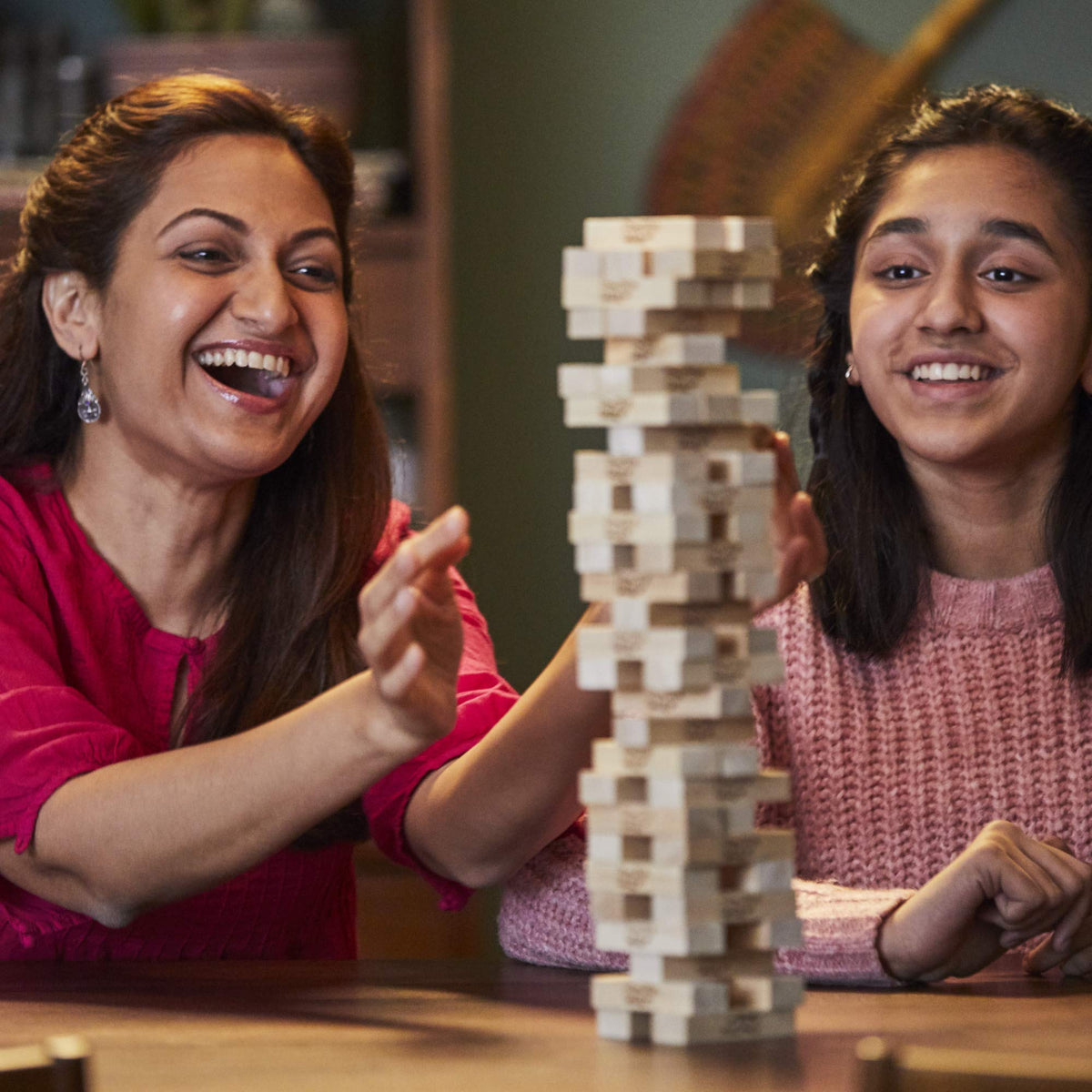Hasbro Jenga tower close-up showing sturdy hardwood blocks and classic craftsmanship