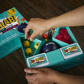 Hasbro Ka-Blab! unboxing scene with box and components.