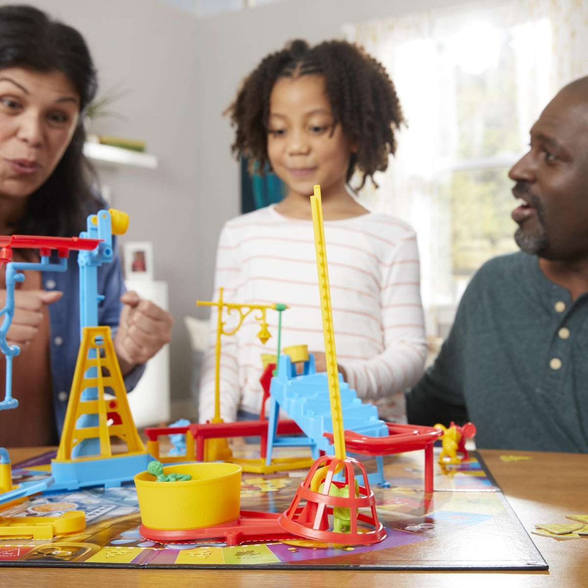 Hasbro Mouse Trap gameplay scene showing family fun and interaction