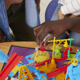 Hasbro Mouse Trap indoor family fun scenario suggests shared laughs.