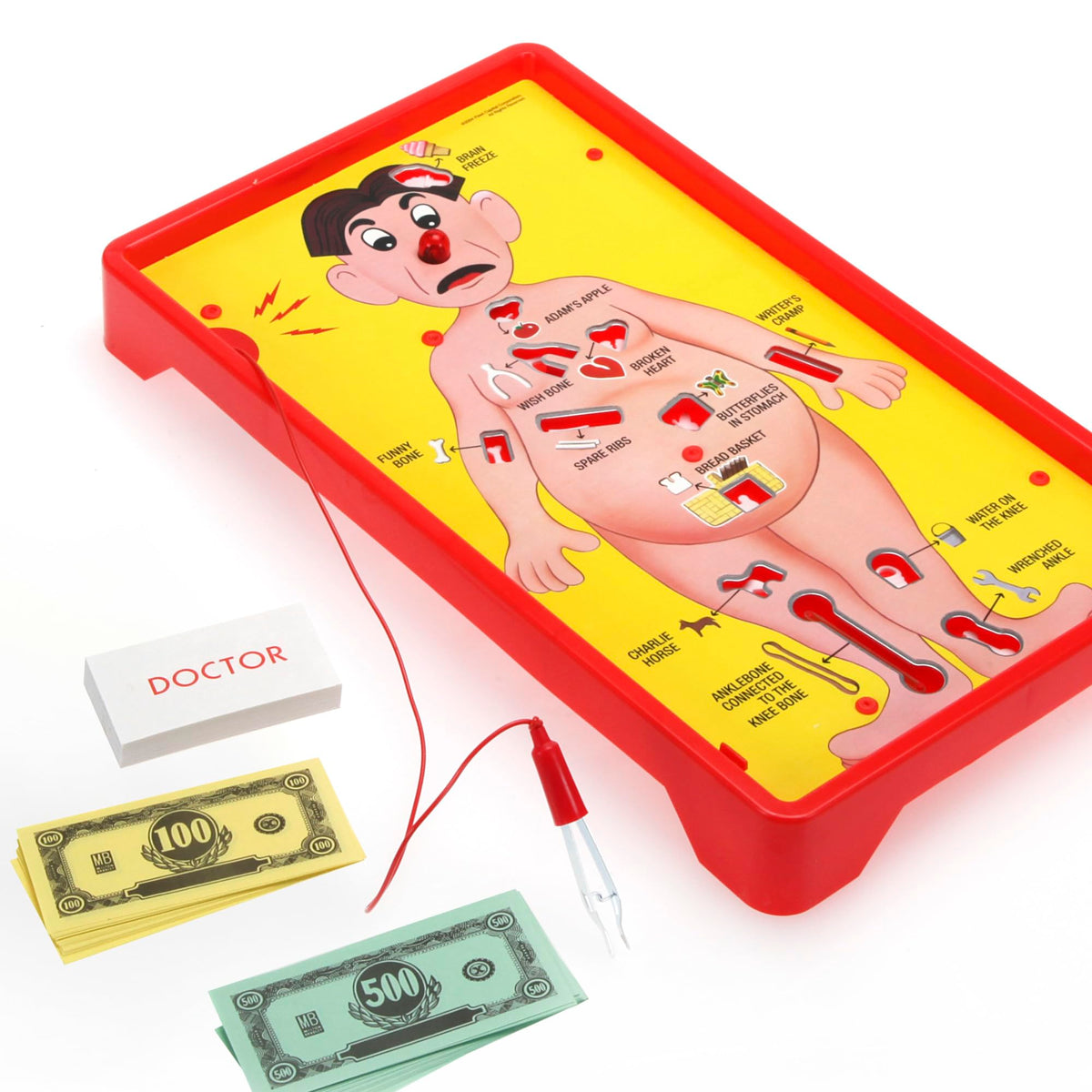 Hasbro Operation tweezers in action removing wacky ailments with precision.