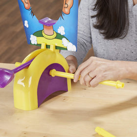Hasbro Pie Face Spinner displayed to control timing and scoring.