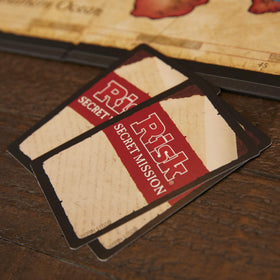Hasbro Risk board game dragon token adds a playful challenge.