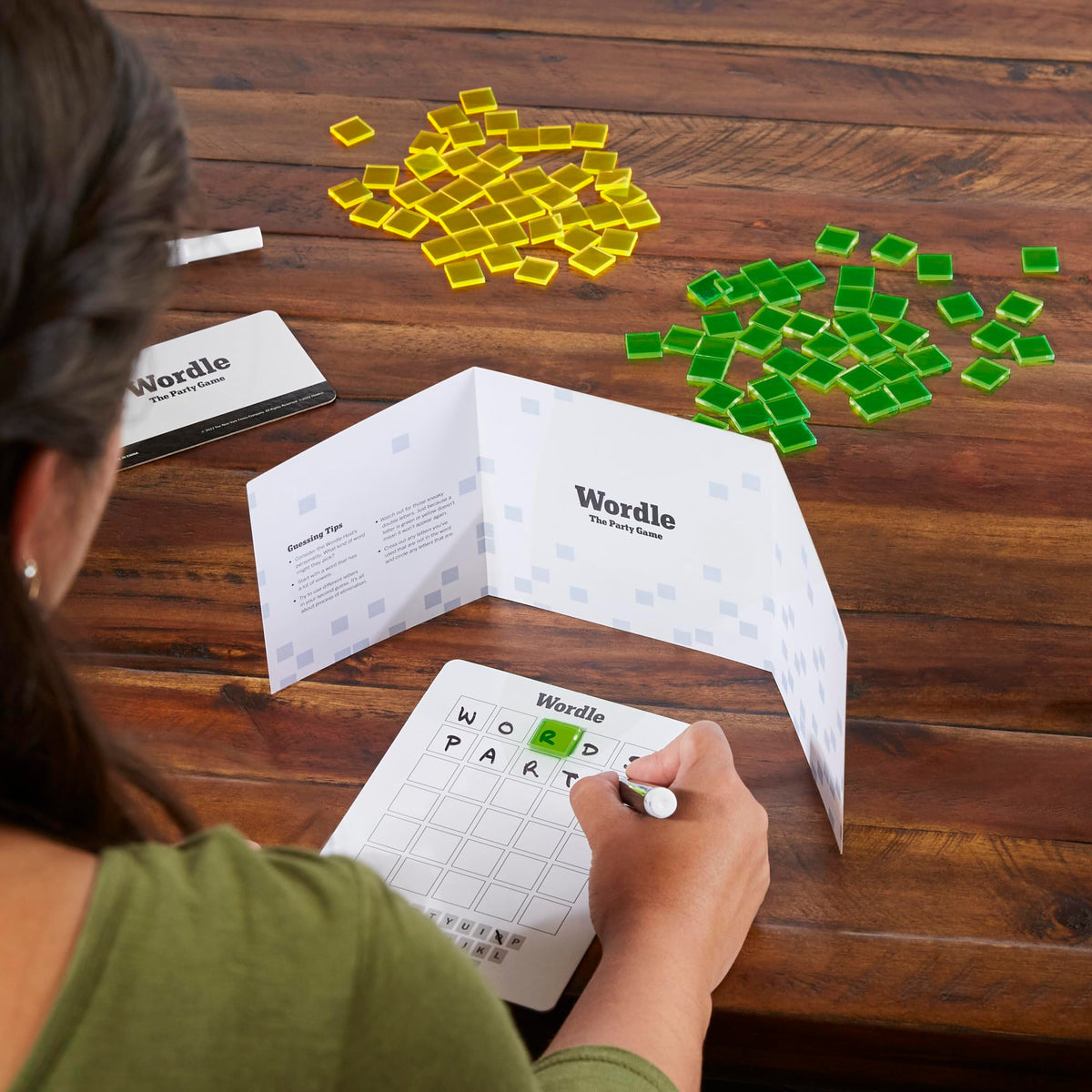 Hasbro Wordle Party Game dry-erase boards enable unlimited rounds.
