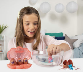 Hatchimals figures nestled beside the shell for imaginative play