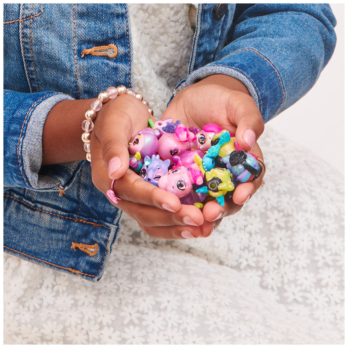Hatchimals gender-reveal egg close-up hints pink or blue for playful surprises.