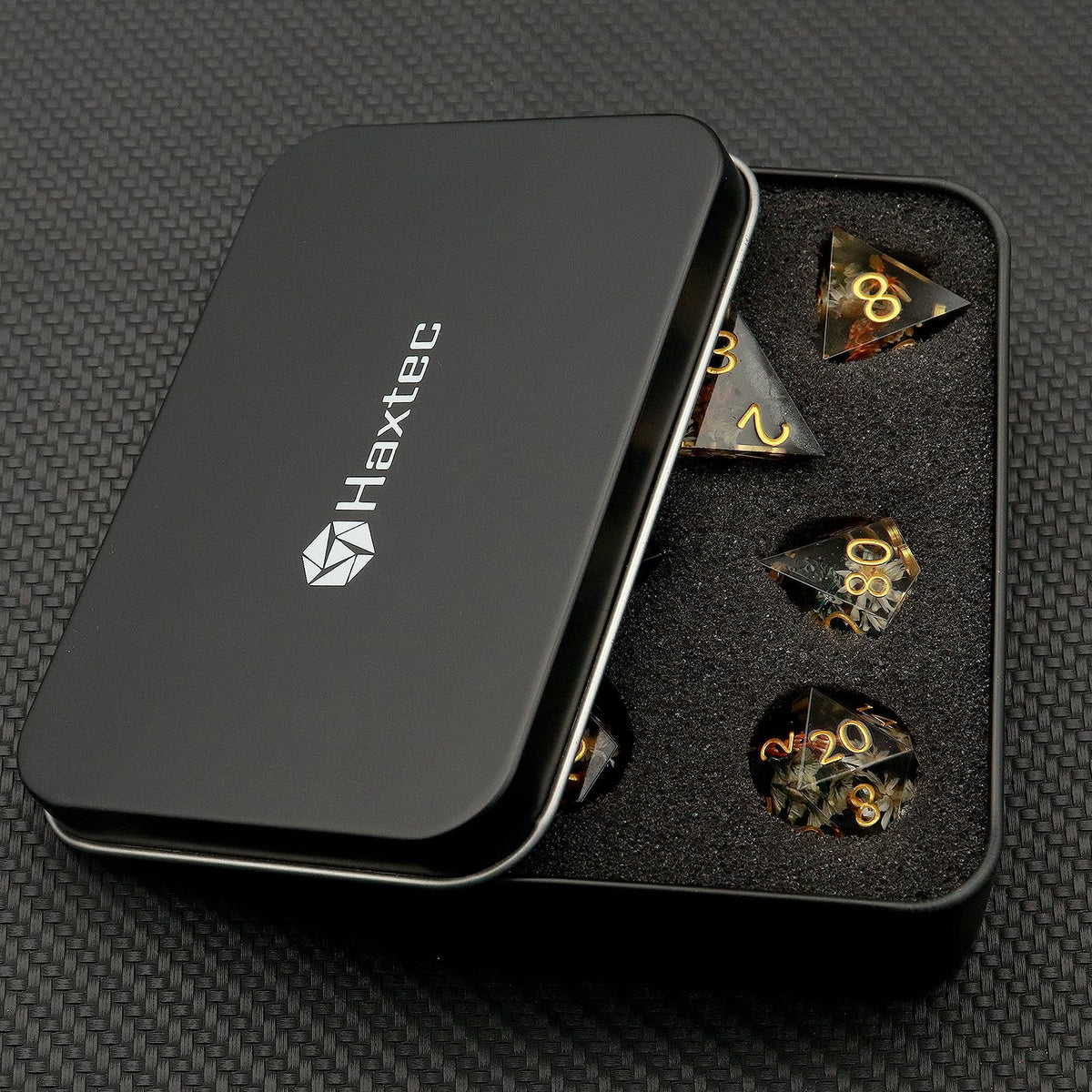 Haxtec winter black floral dice set, layered petals under glassy resin.