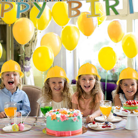 Child wearing a yellow Haysandy construction hat for playful engineering look
