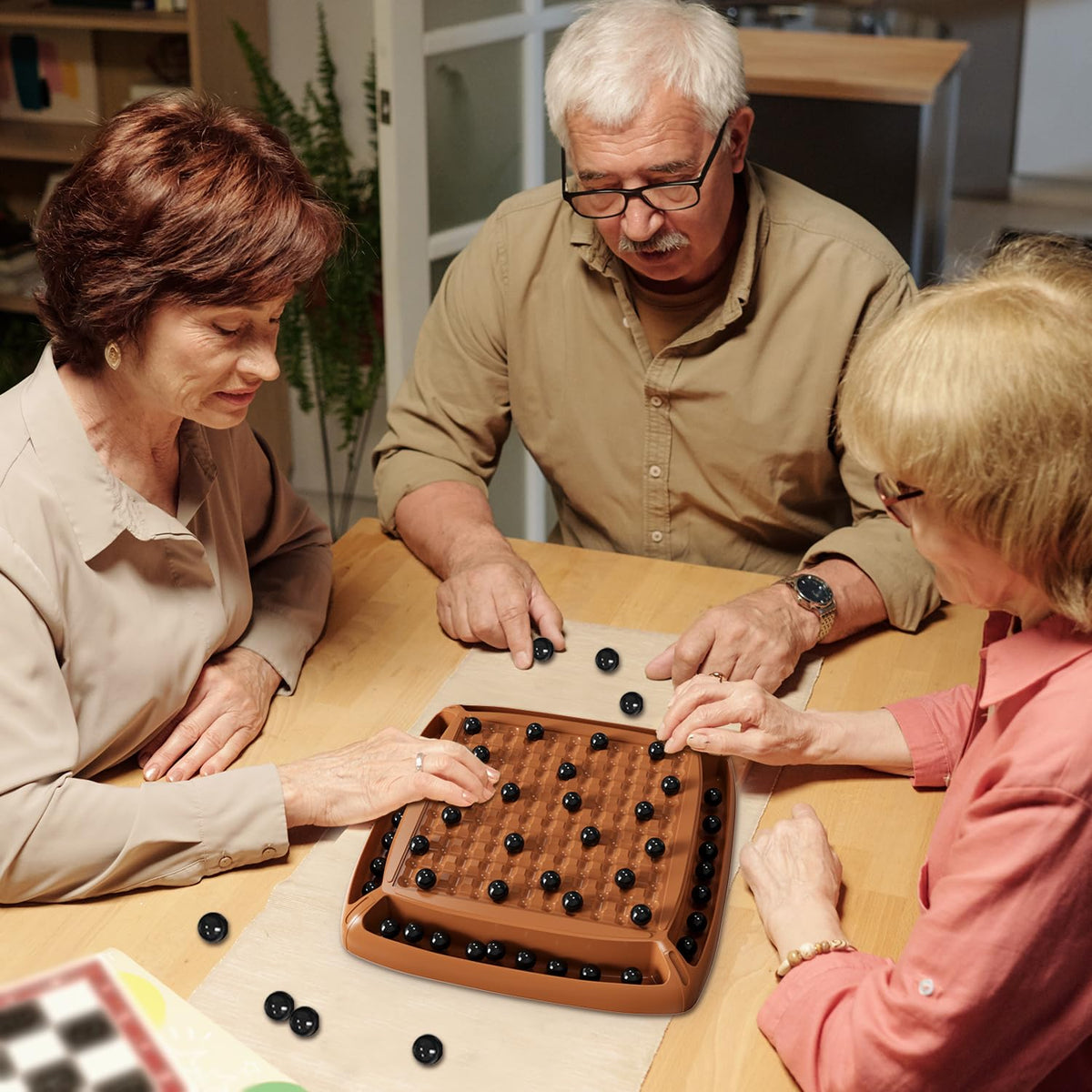 Hcusus family game night featuring magnets and strategy.