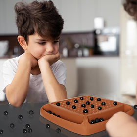Hcusus players taking turns demonstrates 2-4 player excitement and strategy.
