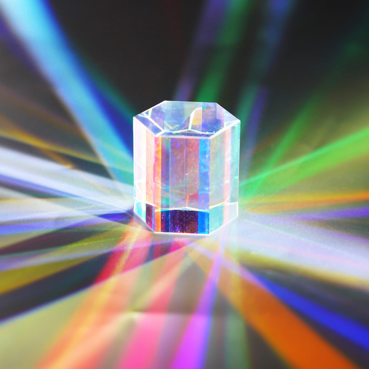 HDCRYSTALGIFTS RGB dispersion prism shows vibrant rainbow reflections for photography.