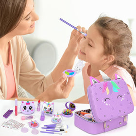 Heaning makeup brushes, puff, and sponge for kid-friendly application.