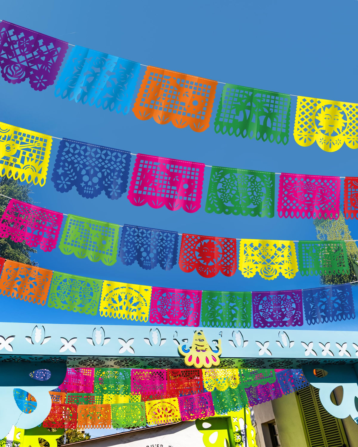 Heartome fiesta banner displayed across yard and wall for festive ambiance