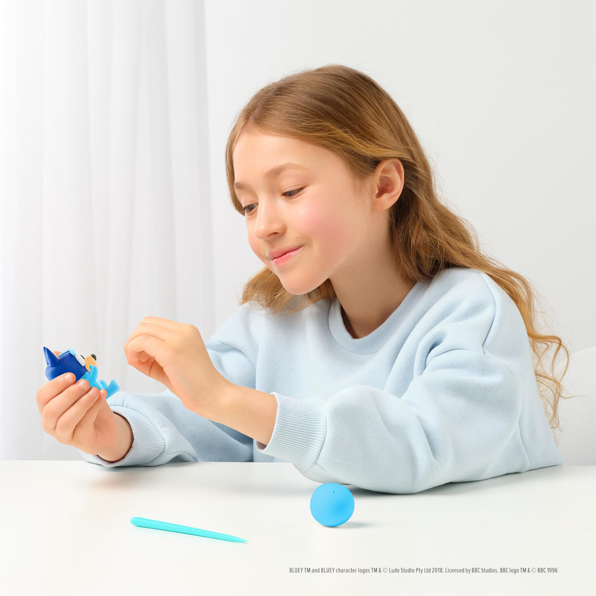 Child crafting scene with HEY CLAY Bluey Friends kit