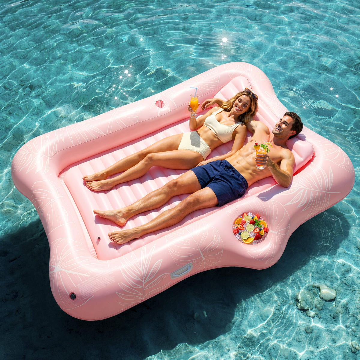 HeySplash inflatable pool float lounge with pink leaf pattern for stylish poolside lounging