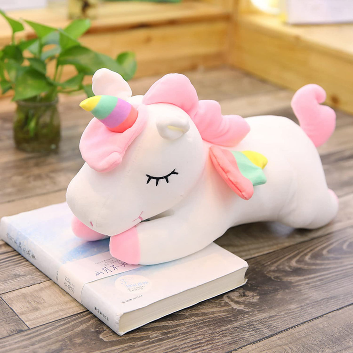 hitoshe unicorn plush doubles as a soft pillow for resting and reading.