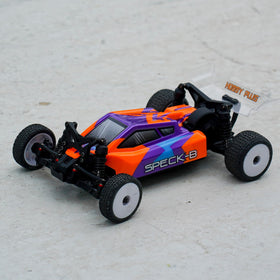 HOBBYPLUS Speck B 1/24 RC buggy in high-speed action with agile handling.