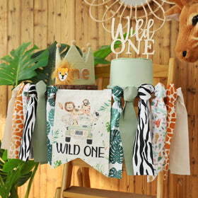 HODIHIWI Wild One wooden cake topper highlights celebratory cake.