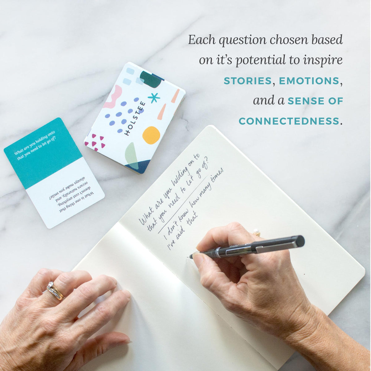 Holstee Reflection Cards on coffee table invite daily reflection.