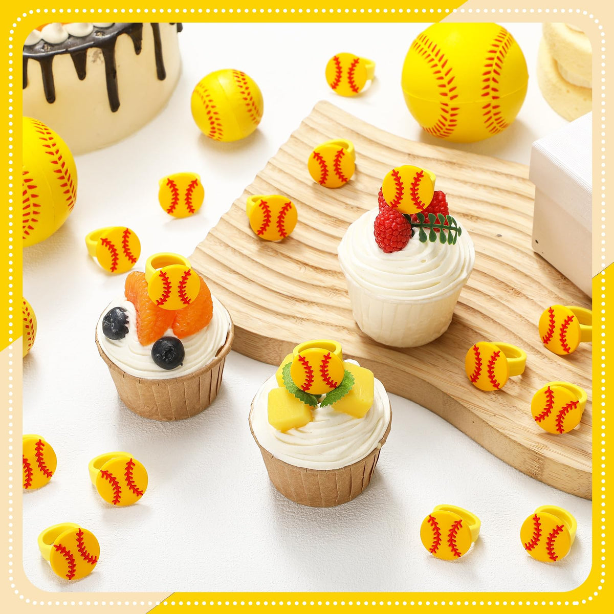 Honeydak softball themed toppers on cupcakes during party setup